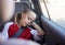 Soccer, travel and girl sleeping in a car tired from sports practice, training and fitness workout for children