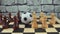 Soccerball among pawns on a chessboard