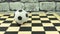 Soccerball souvenir on a chessboard