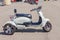 Sochi Adler, Russia - September 7, 2019: Close up of three wheels Electro scooter parked for rent
