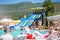 Sochi, Russia, 08.14.2019: Many different slides and attractions in the children`s pool in the aquapark