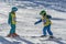 Sochi, Russia, 10-01-2018. Rosa Khutor ski resort. A boy and a girl from a group of mountain skiing training train with each other