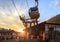 Sochi, Russia - August 8, 2013: Cableway gondola ski lift lower station in Rosa Khutor mountain resort at sunset in summer. Scenic