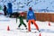Sochi, Russia - January 7, 2018: Female ski instructor teaches skiing to little girl on snowy mountain slope in Gorky Gorod winter