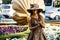 SOCHI, RUSSIA - June 5, 2018: living statue young woman painted in gold