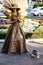 SOCHI, RUSSIA - June 5, 2018: living statue young woman painted in gold