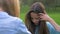 Sociable young girl talking to her girlfriend and combing hair doing himself hair. emotions pleasure and smile