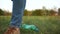 Social concept. A woman throws a plastic bottle under her feet, steps over it and leaves. Stop plastic