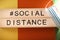 Social distance poster with face mask and hashtag