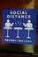 Social Distance word sticker on the table