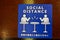 Social Distance word sticker on the table