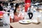 Social distancing,asian child girl is eating at a food court,new normal life after Coronavirus quarantine or Covid-19,people to