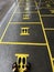 Social Distancing or Safe Distancing Floor with yellow footprint sign sticker and yellow attention line for stores and supermarket