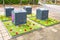 Social garden experiment with plastic Oracs mini-yards around underground dirt containers