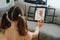 Social little girl with violin, waving her hand to her grandma in a video chat