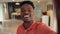 Social media influencer, black man in real estate moving to new home and live streaming online. Digital home tour