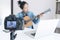 social media learning concept, relaxing and playing guitar, Young woman concentrating learn and play the guitar to a tutorial on