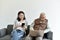 Social media network addiction, Family relationship conflict, Senior asian old father and daughter busy with their smartphone.