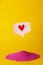 Social media promotion success concept. Pink heart-shaped emoji