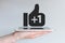 Social network thumbs up icon with plus sign. Concept of mobile computing and social media.