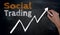 Social trading is written by hand on blackboard