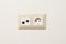 Sockets on white wall. Multifunction outlet with internet connection, tv and electric socket plug with grounding, copy space