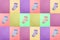 Socks for children. View from above. Multi-colored striped socks on pink, mustard, purple, violet and green backgrounds. Abstract