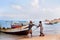 Socotra, Yemen, March 9, 2015 Simple rural fishermen returning from fishing to drag the boat out of the water on the shores of an