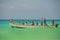 Socotra, Yemen, March 9, 2015 Simple rural fishermen returning from fishing to drag the boat out of the water on the shores of an