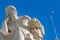 Socrates white marble statue, the ancient philosopher and Greek flag under pristine blue sky