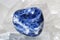 Sodalite laid on druze of quartz