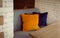 Sofa with colorful pillows. Living room interior. Elegant cafe furniture. Apartment decoration.