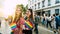 Sofia / Bulgaria - 10 June 2019: smiling Girls in LGBT parade with rainbow flag in the street. Gay and lesbian festival supporting