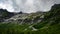 Sofia waterfalls, mountains, clouds, trees on the background of mountains