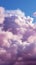 Soft allure Fluffy cumulus clouds dance in serene pink purple skies