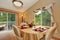 Soft beige dining room interior with nicely decorated table