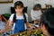 Soft blur of little girl has fun with table soccer while grandparent enjoy use mobile phone as background