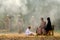 Soft blur of muslim family look to group of soldier come from the jungle during the battle near the village