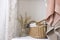 Soft color provence style bathroom items. Laundry. Basket with clothes to wash