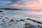 Soft color sunrise on Iona beach, Scotland