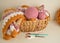 Soft coloured woolen balls with granny square blanket and crochet hook in basket