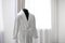 Soft comfortable bathrobe on mannequin in room