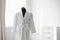 Soft comfortable bathrobe on mannequin in room