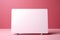 Soft contrast: White card stands out on pastel pink, a blank communication canvas.