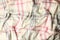 Soft crumpled checkered plaid as background, top view