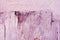 Soft dirty pink painted surface close up detail, grunge horizontal background