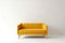 soft empty yellow sofa stands on white isolated background, comfortable fabric couch is alone against the background of white wall