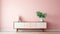 Soft And Feminine Credenza Against Pastel Pink Wall