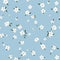 Soft Floral Breeze: Tiny Flower Pattern on Baby Blue Backdrop