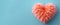 Soft fluffy peach heart on a blue background